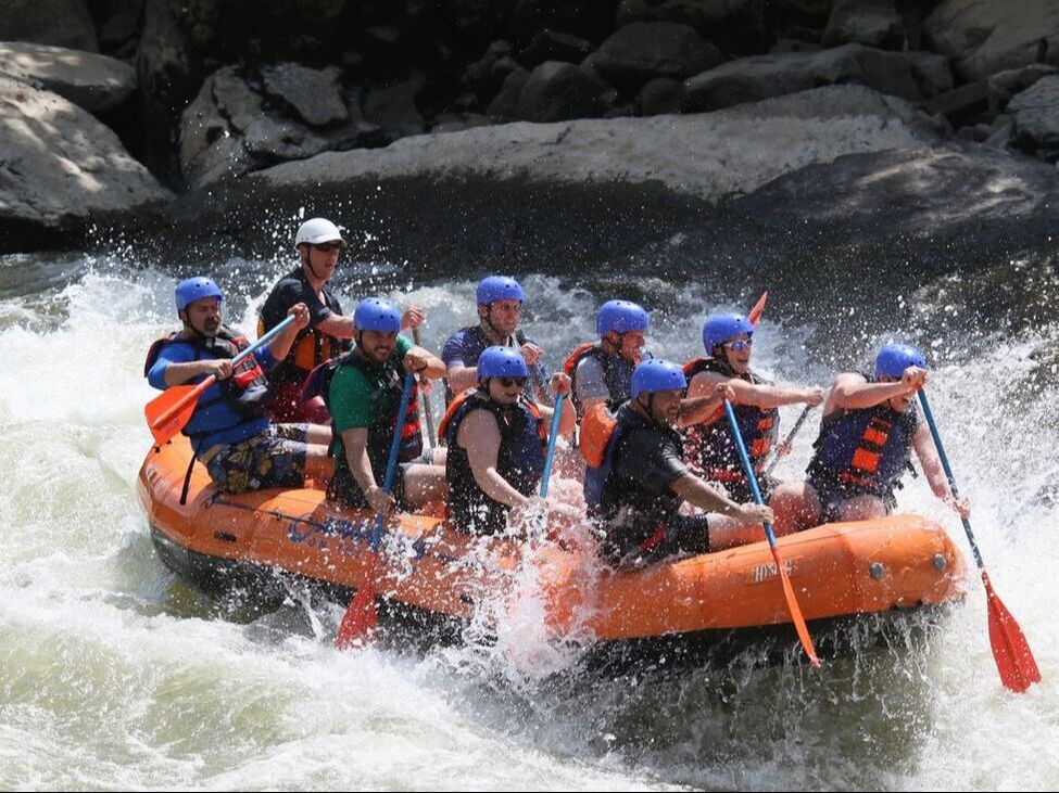 Photo of Clay Riley and the Riley Kids Whitewater Rafting Down The WV Gaulley